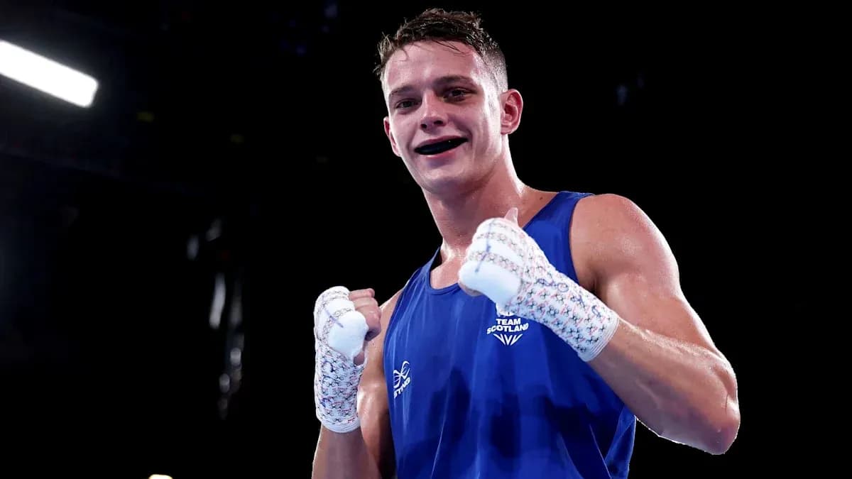 Boxer from Team Scotland celebrating in the ring