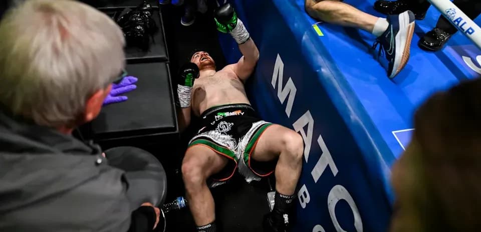 Boxer lying on the ground after a match