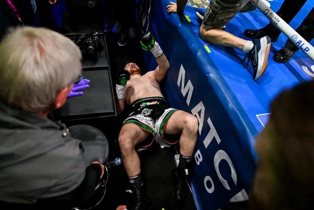 Boxer lying on the ground after a match