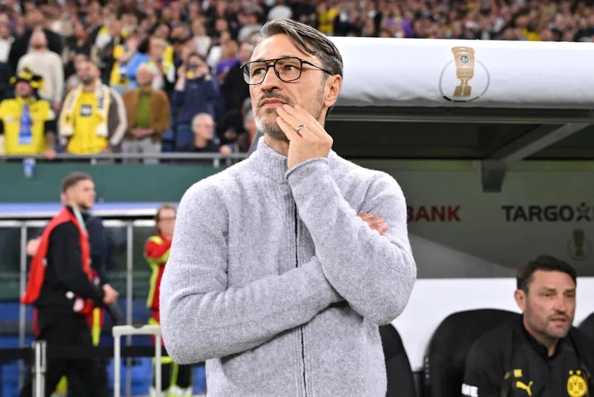 Coach observing the match from the sidelines