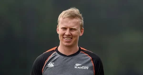 Cricketer in Blackcaps training attire smiling
