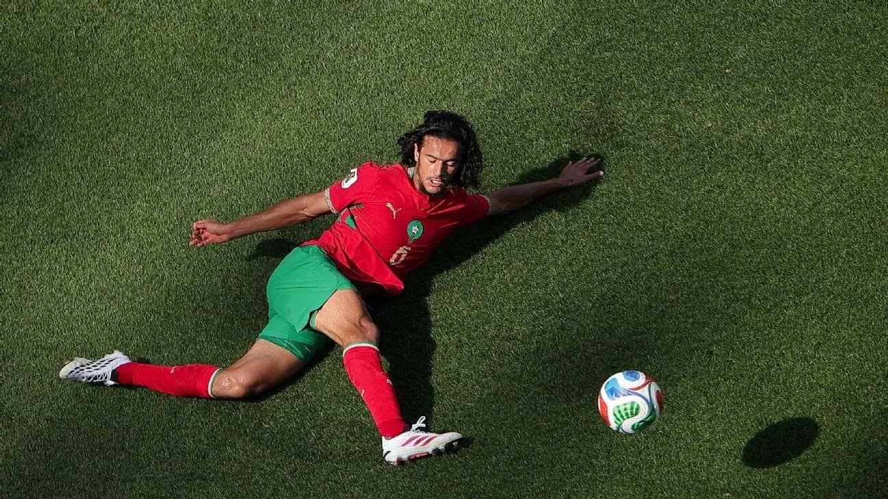 Player from Morocco sliding on the grass field