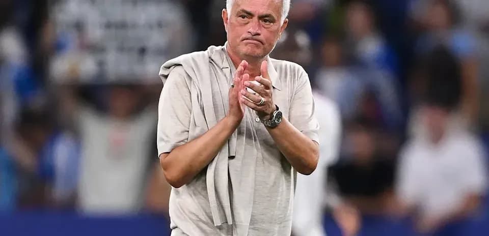 Coach applauding fans after match conclusion