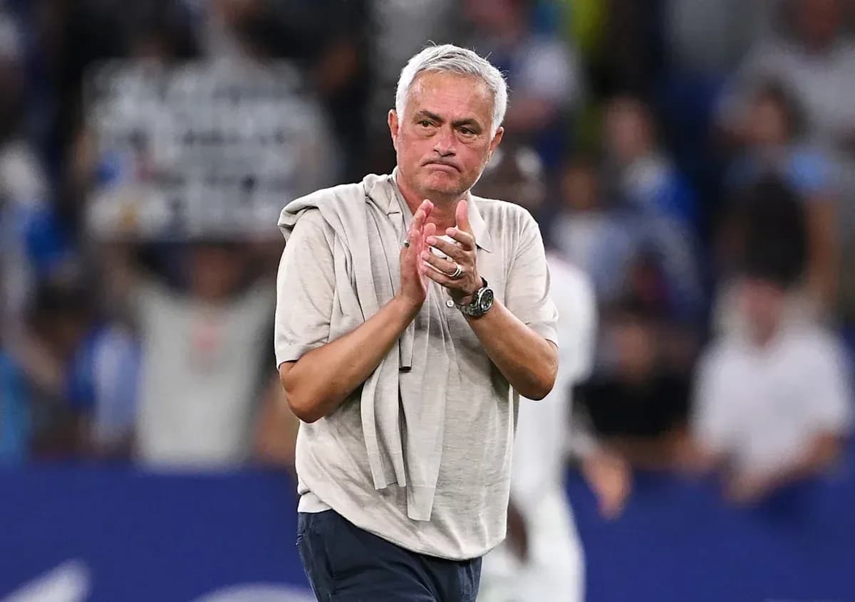 Coach applauding fans after match conclusion