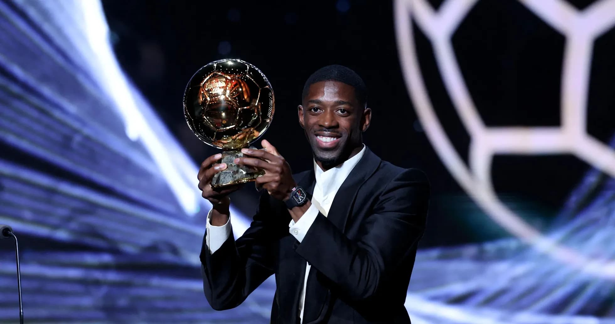 Player holding the Ballon d'Or award on stage
