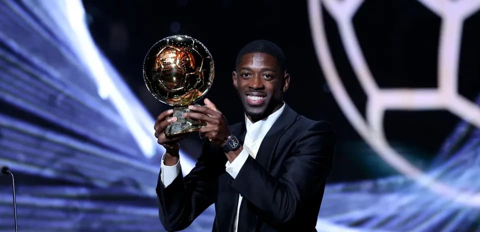 Player holding the Ballon d'Or award on stage