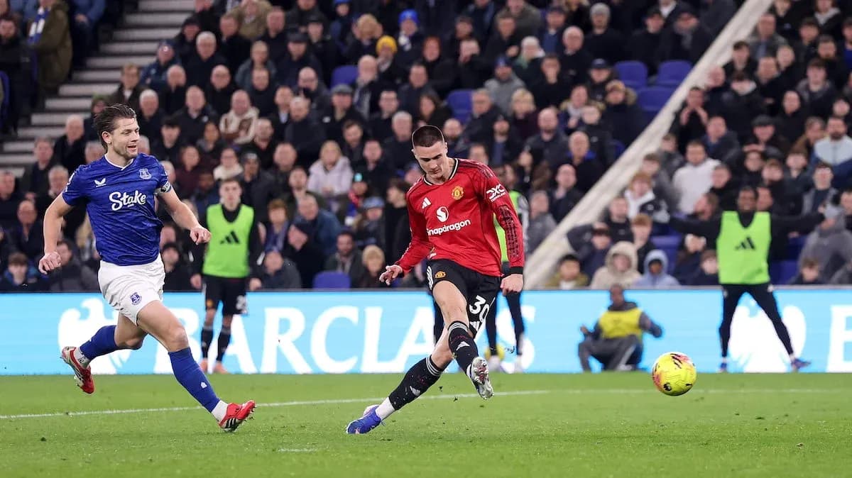 Player shooting during Everton vs Manchester United match