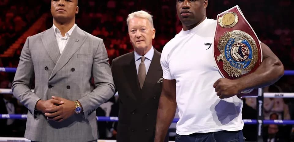 Two boxers and a promoter at press event