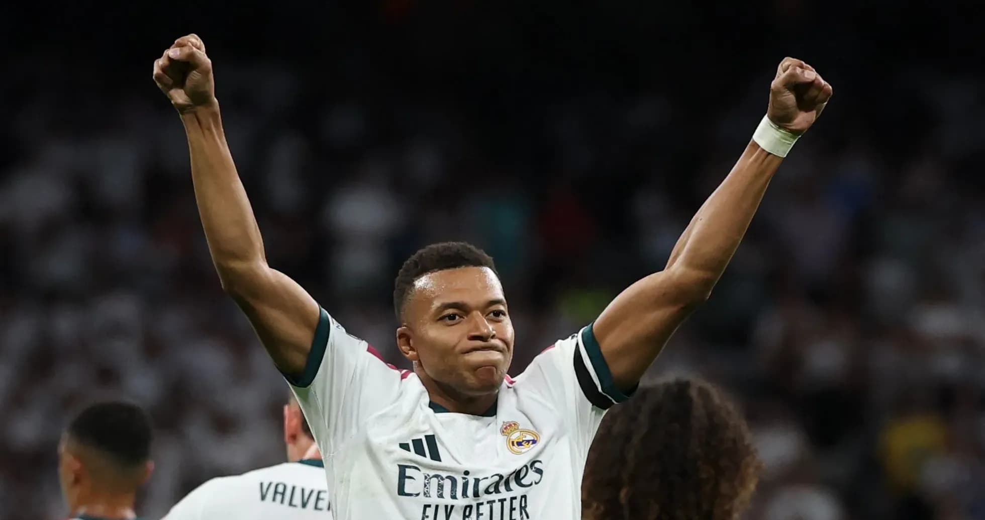 Player celebrating with raised fists after scoring