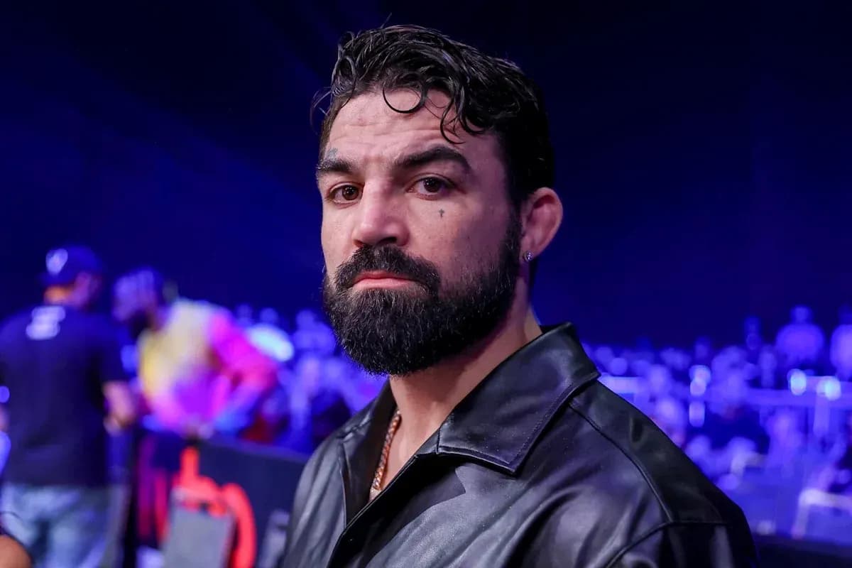 Man with beard and leather jacket in arena