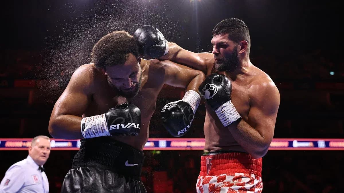 Boxers exchanging punches in a boxing match