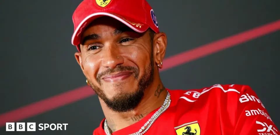 Driver in Ferrari cap during press conference