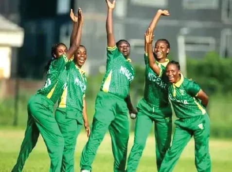 Five Nigerian cricket players celebrating on field