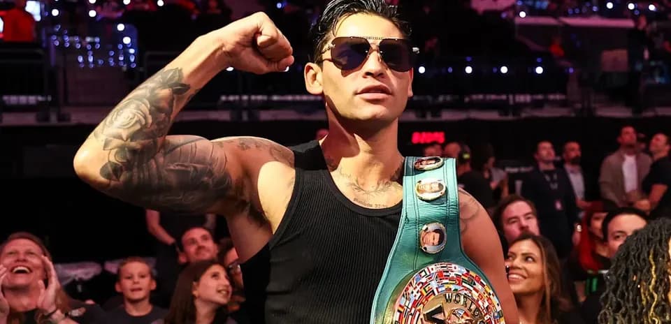 Fighter posing with WBC championship belt in audience