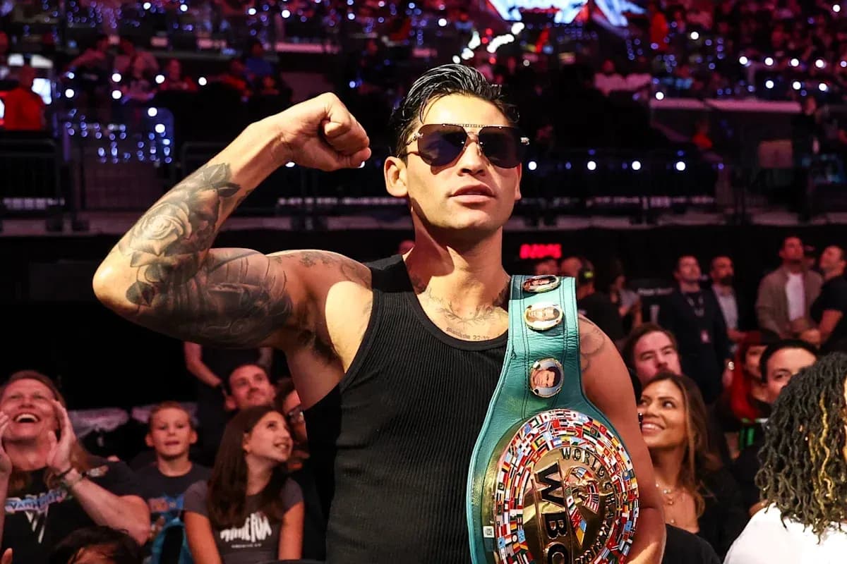 Fighter posing with WBC championship belt in audience