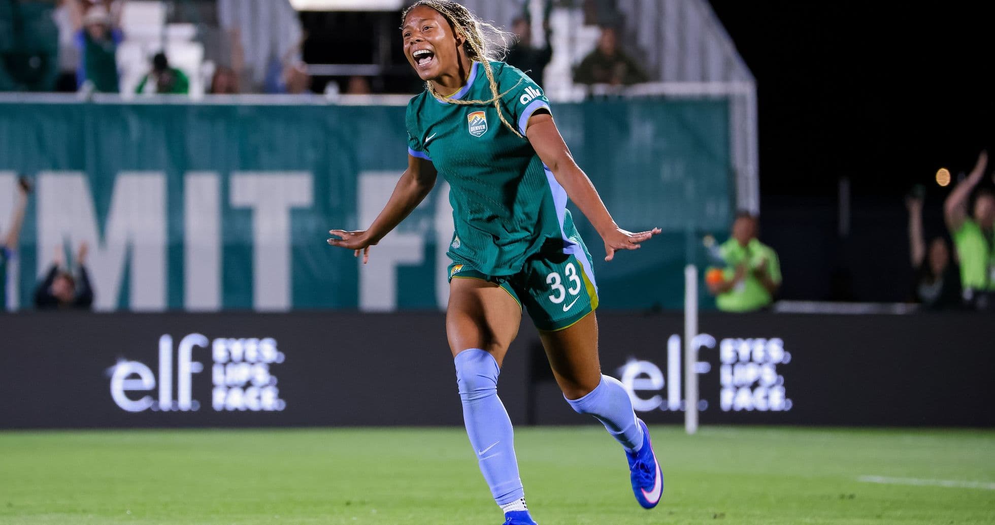 Player celebrating after scoring a goal on field