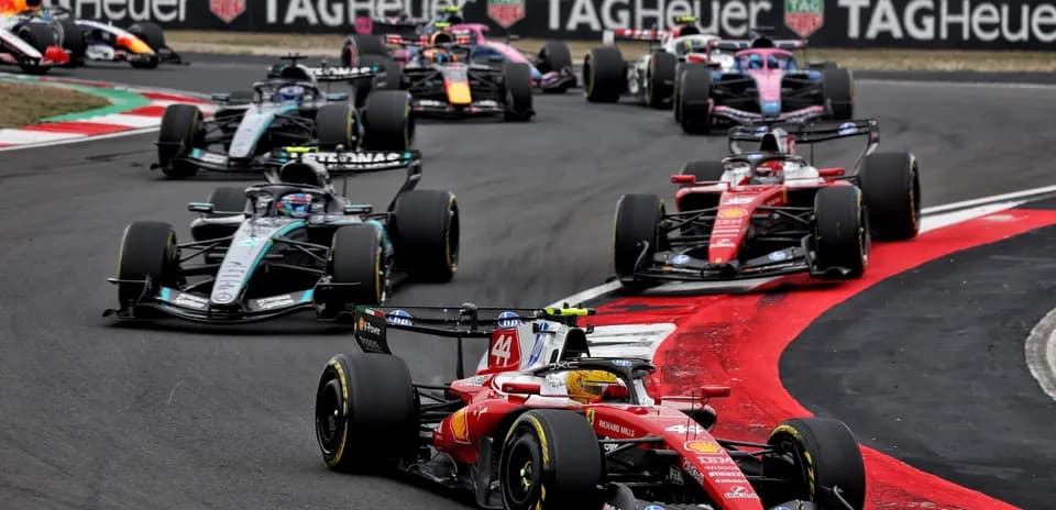 Multiple Formula 1 cars racing on track