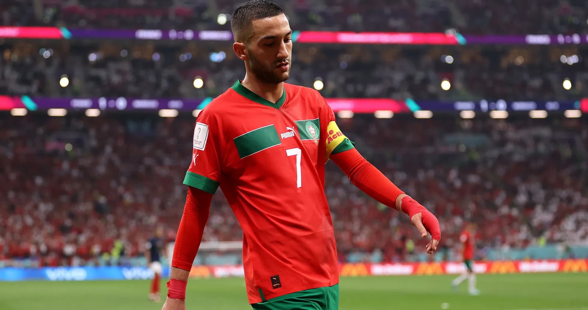 Player wearing Morocco kit walking off the pitch