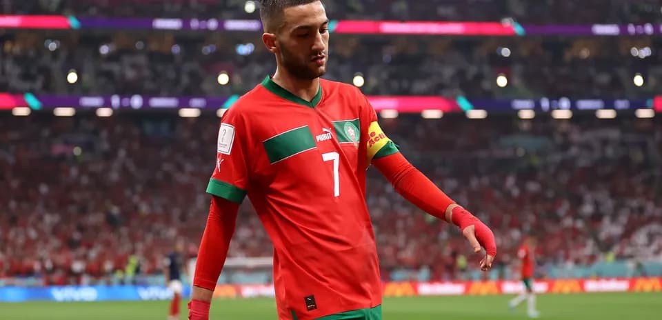Player wearing Morocco kit walking off the pitch