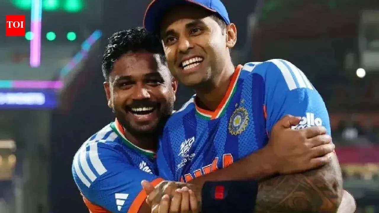 Two cricketers celebrating together on the field
