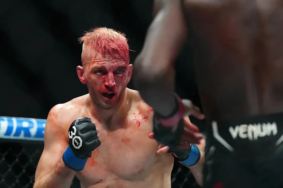 Fighter with blood on face during intense match