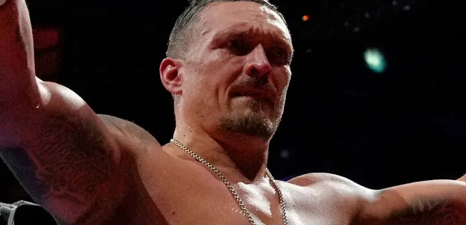 Boxer celebrating victory with raised arms