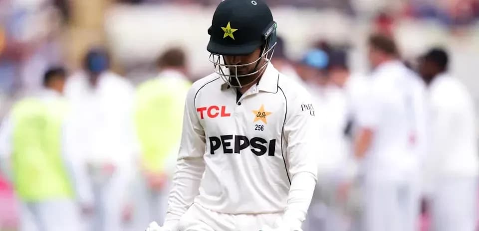 Pakistani cricketer walking off the field after dismissal