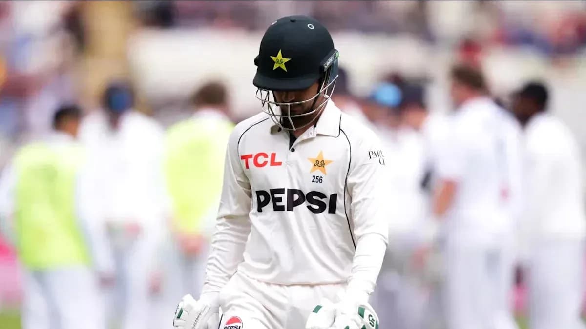 Pakistani cricketer walking off the field after dismissal