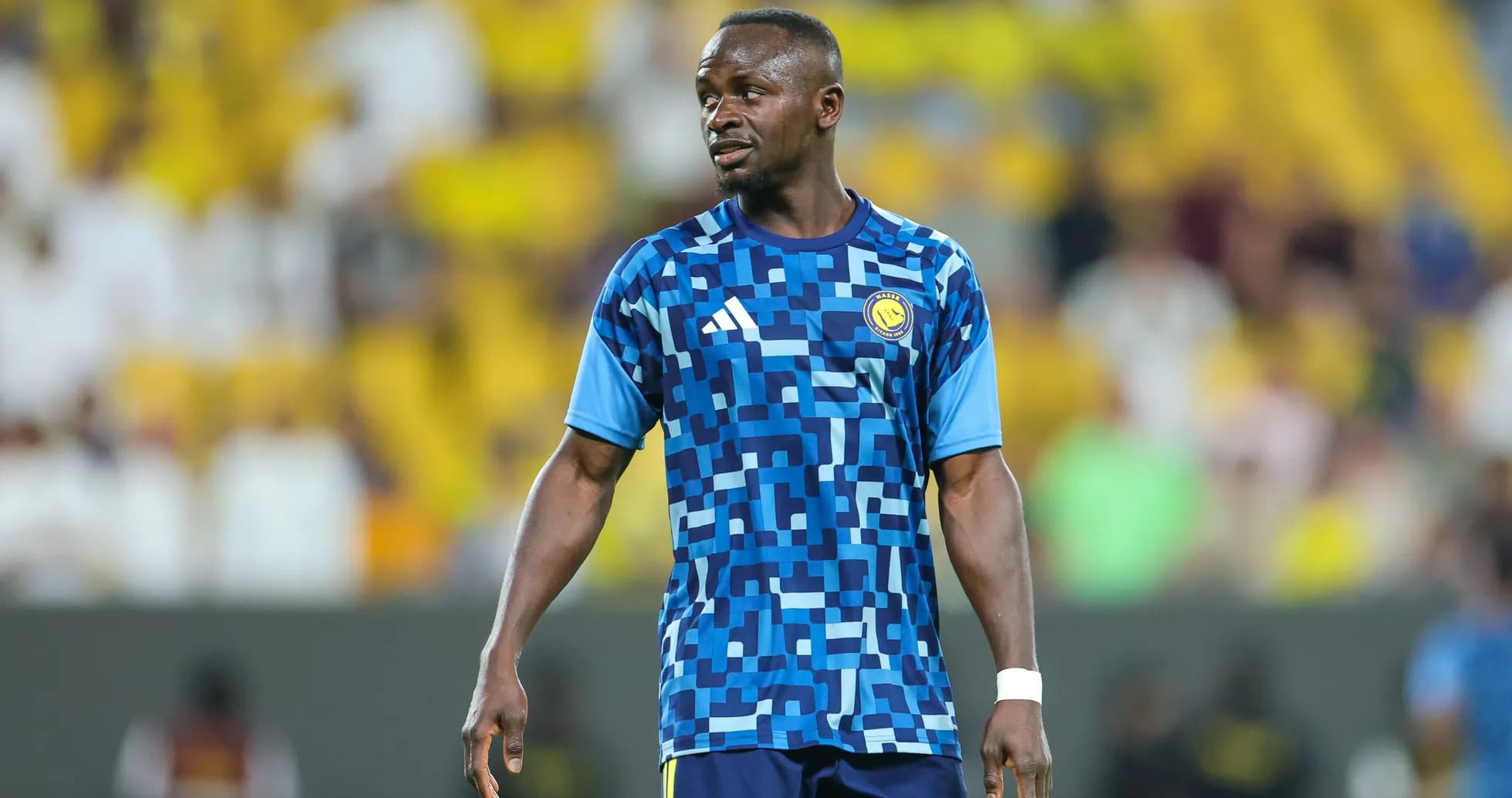 Player in blue training kit on the field