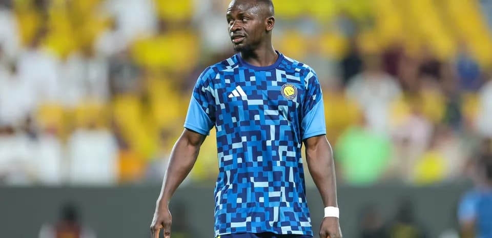Player in blue training kit on the field