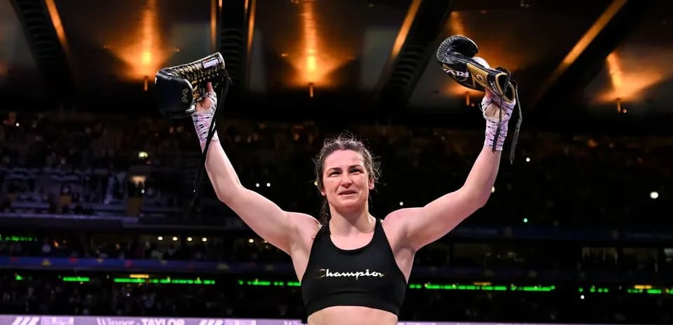Boxer celebrating victory with gloves raised