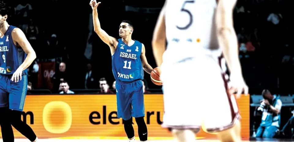 Player 11 from Israel signaling during basketball game