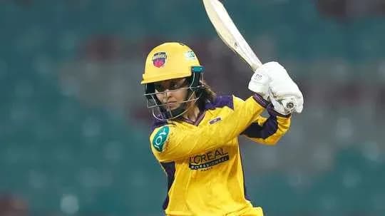 Batsman preparing to strike the ball in match