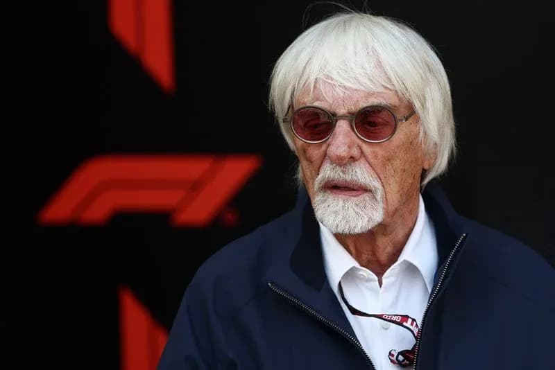Man with white hair and sunglasses at event