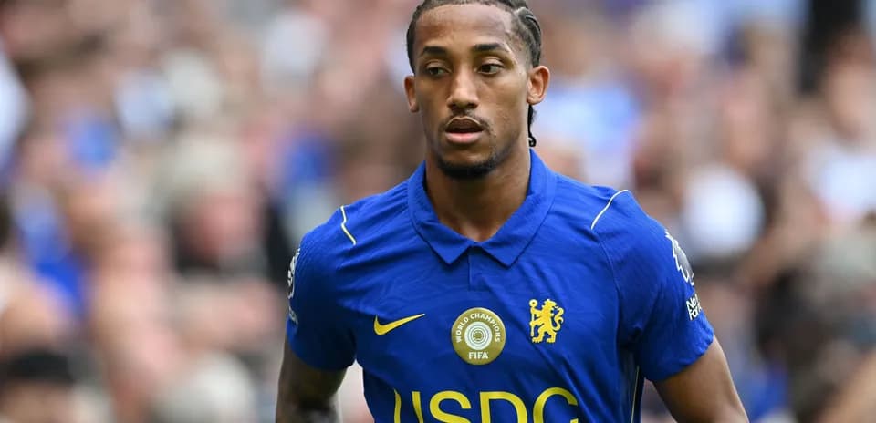 Player in blue Chelsea kit walking on field