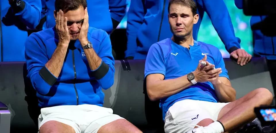 Roger Federer and Rafael Nadal seated during event
