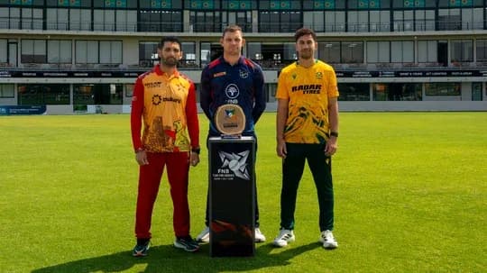 Captains posing with trophy before cricket match