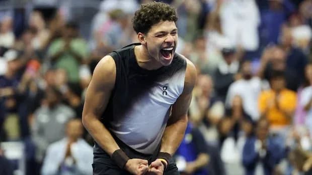 Player celebrating victory during a tennis match