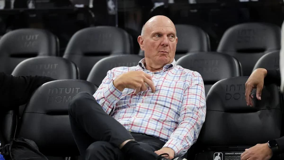 Executive seated courtside at basketball game