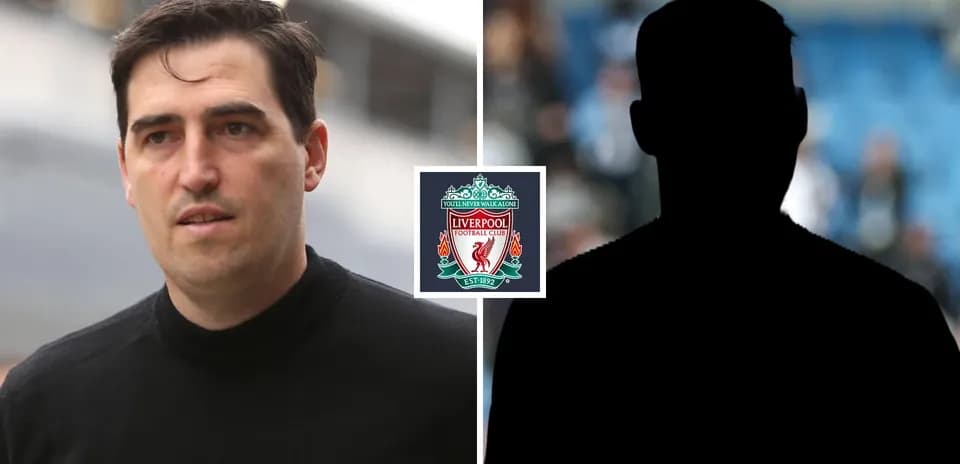 Man walking near Liverpool FC logo on display