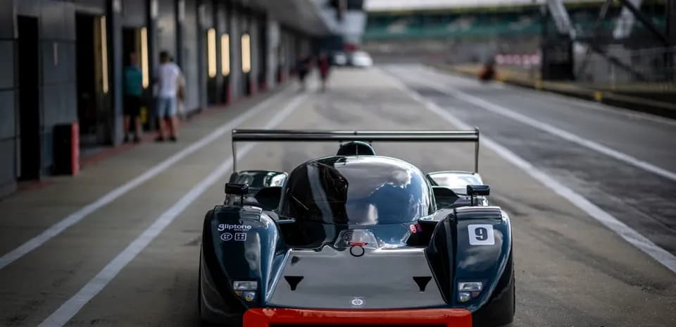 Racing car in pit lane at racetrack