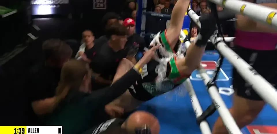 Boxer falling into the crowd during a match