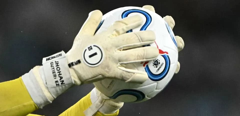 Goalkeeper catching a soccer ball during play
