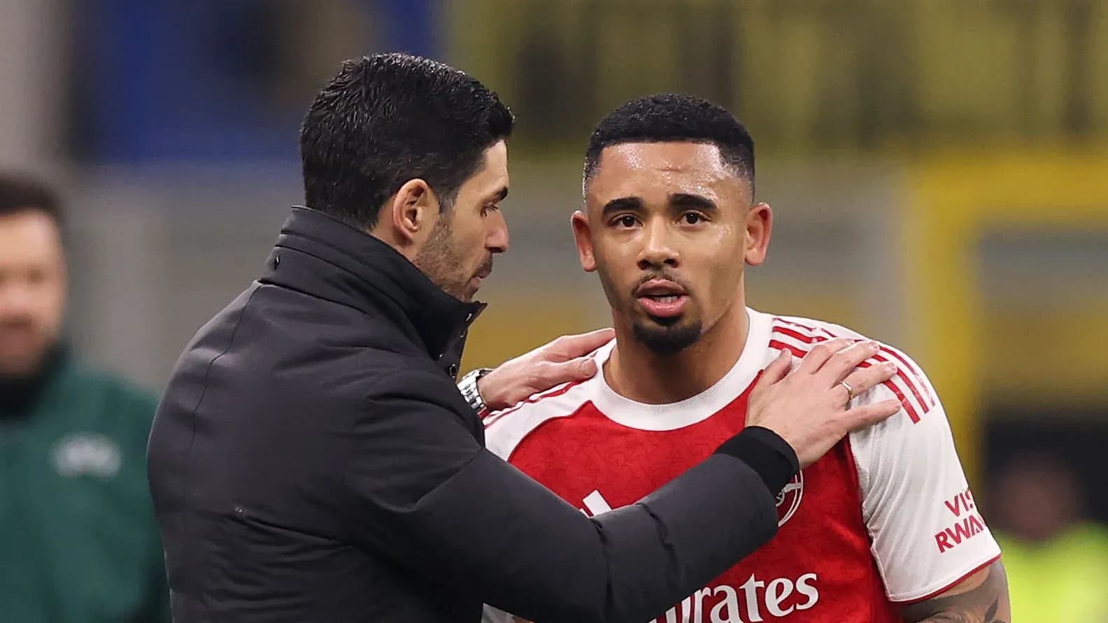 Manager speaking to player during match substitution