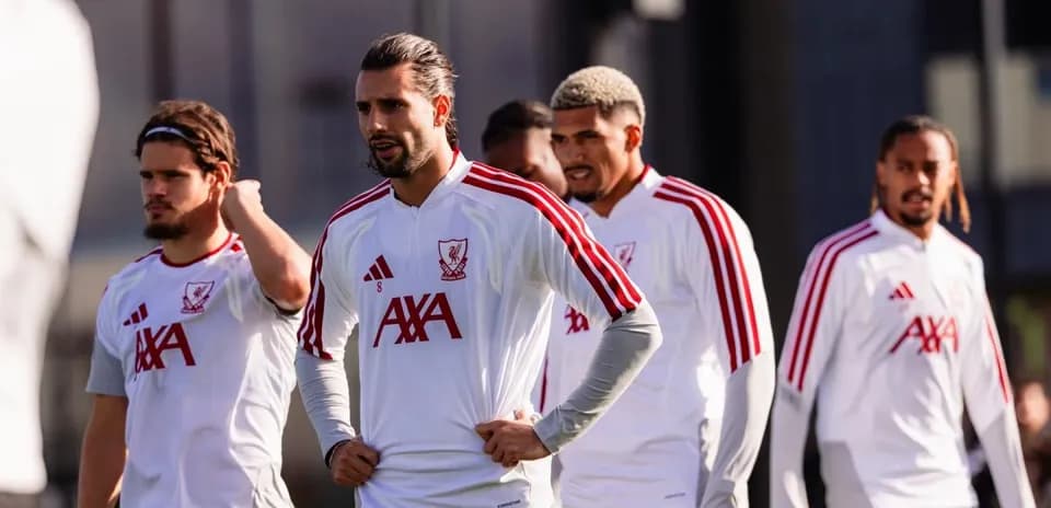 Players in Liverpool training gear during practice session