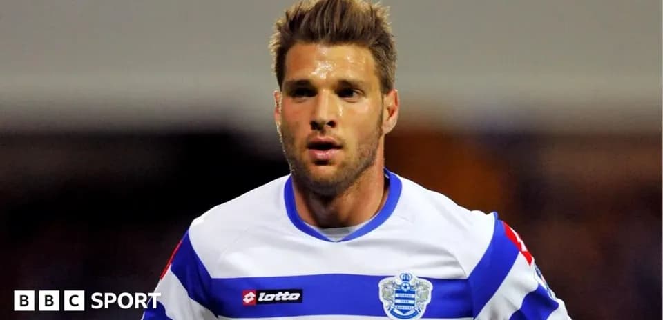 Player in QPR kit running during a match