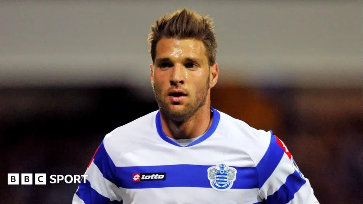 Player in QPR kit running during a match