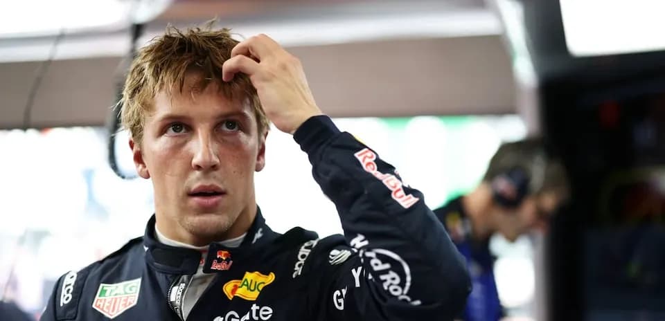 Driver adjusting his hair in the garage