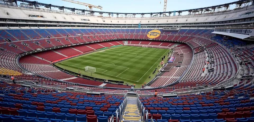 View of empty stadium with pitch and seating