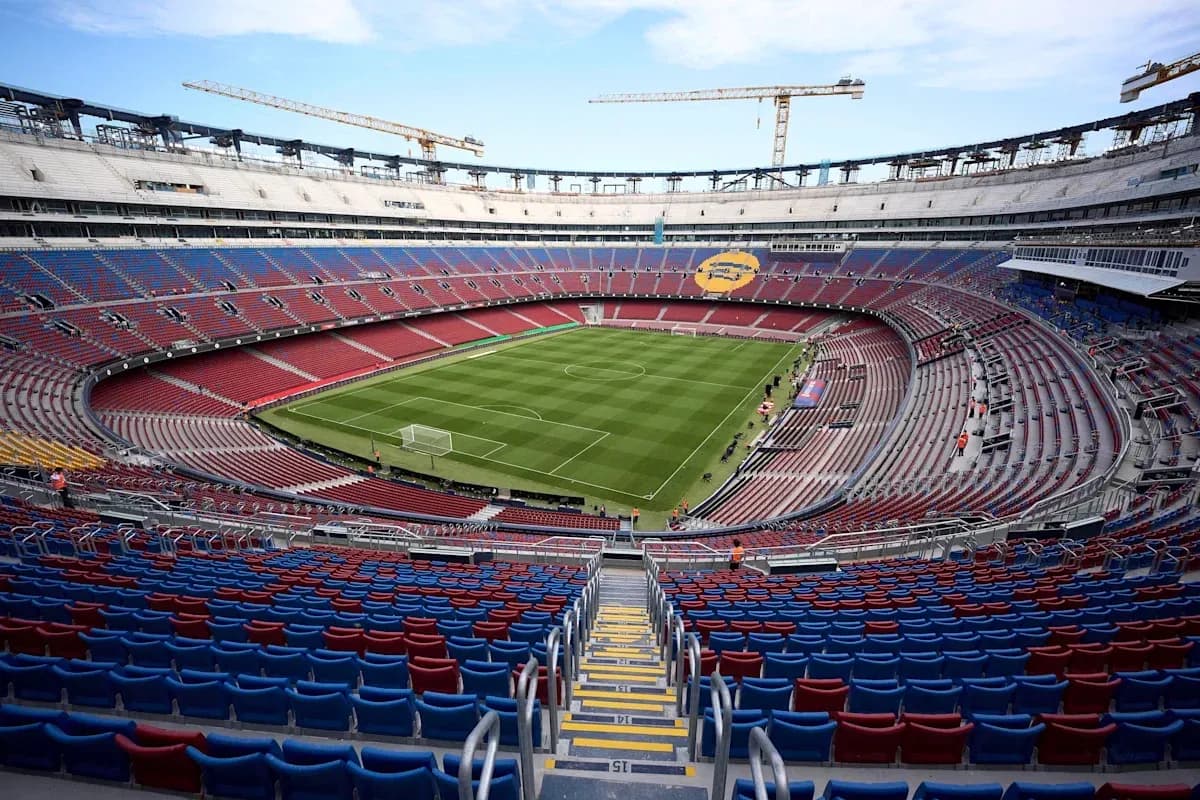View of empty stadium with pitch and seating